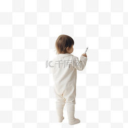 一个小孩在墙上写字的后面景色
