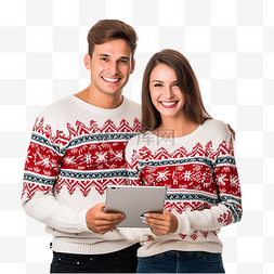穿着圣诞毛衣拿着数码平板电脑的