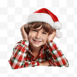 穿着圣诞睡衣和帽子的快乐小男孩