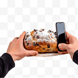 厨房照片图片_面包师用手机拍摄烤圣诞果子蛋糕