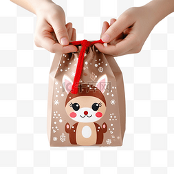 圣诞礼物袋图片_手里拿着可爱的驯鹿装饰的圣诞礼