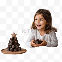 圣诞树食物图片_快乐的小女孩在带圣诞树的家庭厨