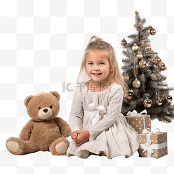 玩具熊礼物图片_圣诞树前地板上带着玩具熊的小女
