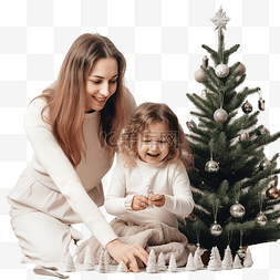 孩子和圣诞树图片_妈妈抱着她可爱的小女儿，装饰圣
