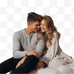 坐地毯上的人图片_可爱的年轻夫妇坐在地毯上，拥抱