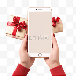 圣诞手机图片_拿着带圣诞礼物的空白手机的女手