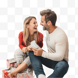 礼物特卖图片_幸福的夫妇在超市选择圣诞袜作为