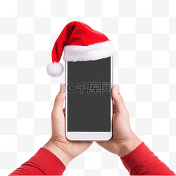 人拿着手机图片_圣诞节时手拿着手机，上面有圣诞