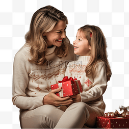 妈妈和女儿带着礼物坐在圣诞树旁