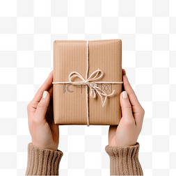 纸盒牛皮纸包装图片_女手展示圣诞假期手工制作的礼物