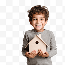 借贷款图片_一个男孩在圣诞树前举着木屋