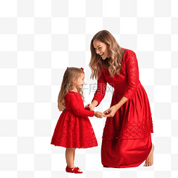 妈妈和女儿穿着红裙子装饰圣诞树