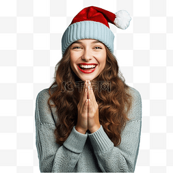 戴着圣诞帽的女孩在孤立的蓝墙上