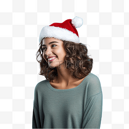 戴着圣诞帽的女孩在孤立的蓝墙上