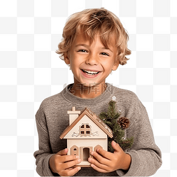 一个男孩在圣诞树前举着木屋