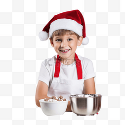 圣诞老人做饭图片_戴着圣诞老人帽子的男孩正在厨房