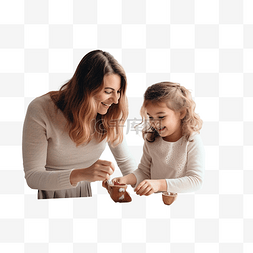 家里玩耍图片_母亲和女儿在家里的圣诞厨房里玩