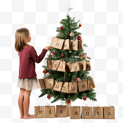 大礼降临图片_一个白人孩子看着圣诞树前装有降