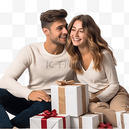 女人坐在桌子旁图片_年轻快乐的夫妇带着礼物坐在圣诞