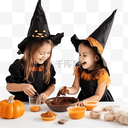 两个穿着女巫服装烘烤饼干的小女