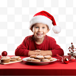 戴着圣诞老人帽子的小孩子坐在桌