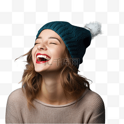 正面看着图片_戴着圣诞帽戴着孤立蓝色的女孩笑