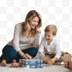 家里过圣诞图片_妈妈和她的小儿子在圣诞树附近的