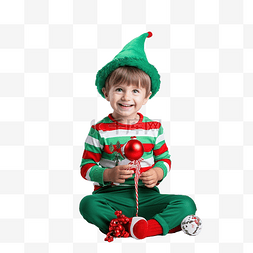 穿着精灵服装的男孩坐在圣诞树下