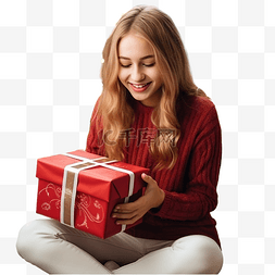 圣诞节打开礼盒图片_圣诞装饰房间里的少女打开礼盒