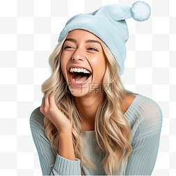 电脑戴尔图片_戴着圣诞帽的女孩在孤立的蓝墙上