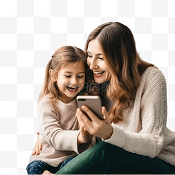 玩手机女图片_妈妈和女儿坐在圣诞树附近