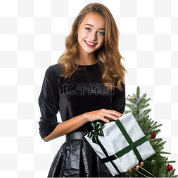 女性模特图片_美丽的年轻女孩拿着礼物站在圣诞