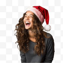 笑着的女人图片_戴着圣诞帽的小女孩在孤立的墙上