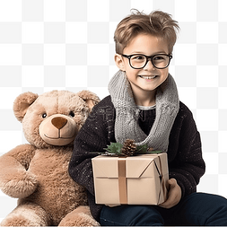 坐在餐桌旁的孩子图片_戴眼镜和泰迪熊的男孩坐在圣诞树