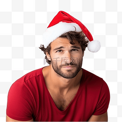 不开心圣诞老人图片_白墙上戴着圣诞帽的年轻有趣的家