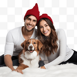 情侣和宠物图片_戴着圣诞帽的快乐的年轻现代夫妇
