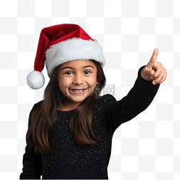 孩子指着图片_蓝墙上孤立的戴着圣诞帽的小女孩
