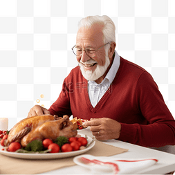 快乐的祖父在圣诞晚餐期间切鸡