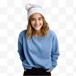 在孤立的蓝墙上戴着圣诞帽的女孩