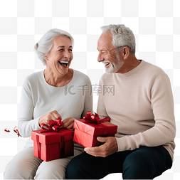 老年人电信诈骗图片_老夫妇在家里微笑着交换圣诞礼物