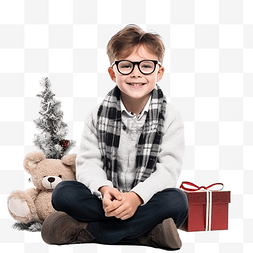 孩子和圣诞树图片_戴眼镜和泰迪熊的男孩坐在圣诞树