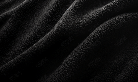 背景黑色粗糙羊毛织物的黑色毛毡织物纹理的特写