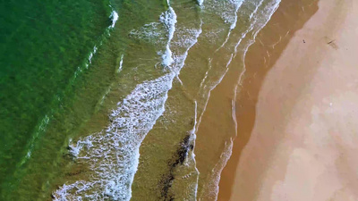 航拍海南陵水清水湾海边沙滩与浪花视频素材实拍视频素材